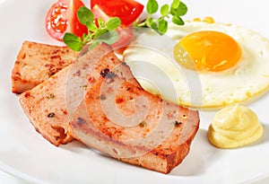 Pan-fried Leberkase with sunny side up fried egg