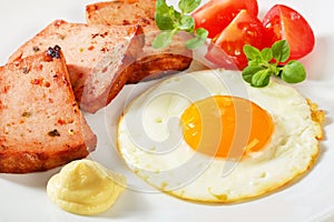 Pan-fried Leberkase with sunny side up fried egg