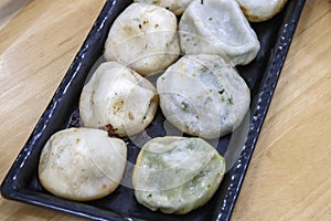 Pan-fried pork buns or named as Sheng Jian Bao in Chinese