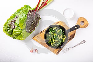 Pan fried swiss chard leaves. Vegetarian or vegan diet, healthy food concept