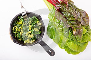 Pan fried swiss chard leaves. Vegetarian or vegan diet, healthy food concept