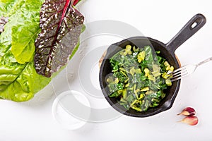 Pan fried swiss chard leaves. Vegetarian or vegan diet, healthy food concept