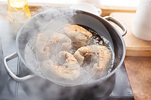 Pan with frying sturgeon fish. Outdoor kitchen. Summer barbeque and vacation