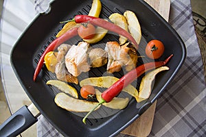 Pan of grilled fish and potato