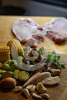 Pan grilled porkchops with corn and sides.