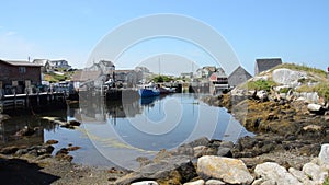 Pan from left to right of the inlet at peggys cove on a calm and sunny summer day, Nova Scotia, Canada