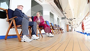 Pan of Senior Couple Relaxing on Cruise Ship Deck