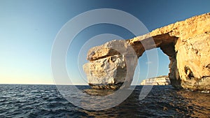 Pan shot view of Azure Window, known as Tieqa ?erqa, a natural rock formation on the coast of Gozo island, Malta