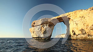 Pan shot view of Azure Window, known as Tieqa ?erqa, a natural rock formation on the coast of Gozo island, Malta