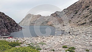 Pan view of  rocky bay of  `Cala fico` located in Saint Peter island, Italy