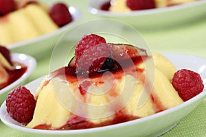 Panacota with fresh raspberries in bowls