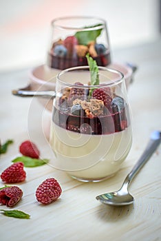 Panacotta dessert with raspberry and blueberry photo