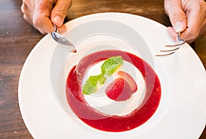 Panacotta with fresh strawberry and sauce photo