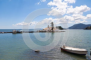 The Panagia Vlacherna Monastery of Panayia with a fisher boat