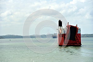 Panama Canal - car carrier ship sailing through Gatun Lake.