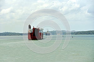 Panama Canal - car carrier ship sailing through Gatun Lake.