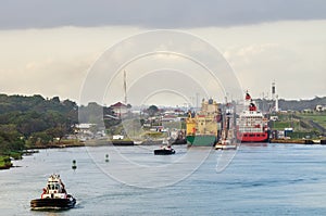 Panama canal, a cargo ship entering the miraflores locks in the