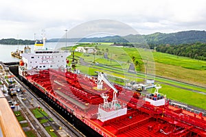 Panama Canal, Panama - December 7, 2019: A cargo ship entering the Miraflores Locks in the Panama Canal