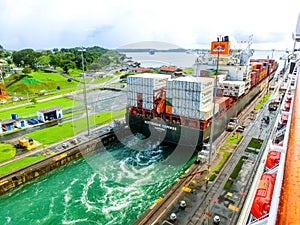 Panama Canal, Panama - December 7, 2019: A cargo ship entering the Miraflores Locks in the Panama Canal