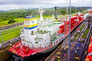 Panama Canal, Panama - December 7, 2019: A cargo ship entering the Miraflores Locks in the Panama Canal