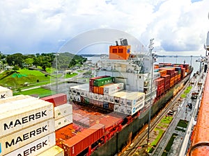 Panama Canal, Panama - December 7, 2019: A cargo ship entering the Miraflores Locks in the Panama Canal