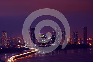 Panama City Night Skyline With Car Traffic On Highway