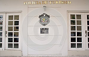 PANAMA CITY, PANAMA - APRIL 20, 2018: Outdoor view of white police spanish building with a shield of national police of
