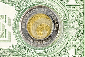 Panama money, Panama 1 Balboa coin on dollar background, Financial concept