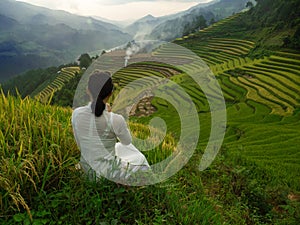 Panaramic view of rice terraces in Vietnam with woman