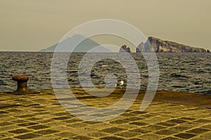 Panarea wharf with stromboli and farallones in the background