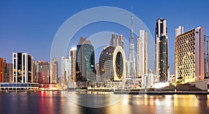 Panaroma of Dubai skyline with Burj khalifa and other skyscrapers at night from Al Jadaf Waterfront UAE