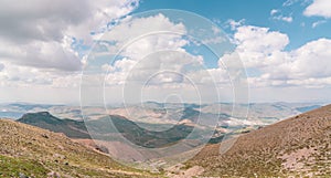 Panaroma landscape of mountains with cloudy blue sky photo