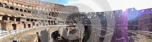 Panaromic view of Colosseum on a sunny day, interior photo of ancient arena. Colosseum, Rome, Italy - July 15, 2013.