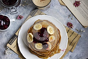 Pancackes on the light table with berries