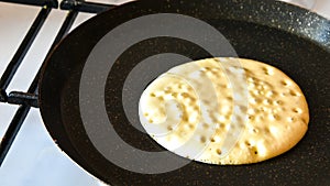 Pancake burn on the pan, homemade pancake fried in a pan in the kitchen