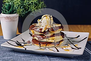 Pancake with chocolate ice-cream on plate