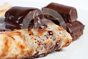 Pancake with chocolate syrup photo
