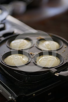 Pancake cooking on the pan.