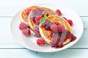 pancake with fresh raspberries and raspberry sauce