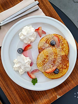 Pancake fruit strawberry and whip cream