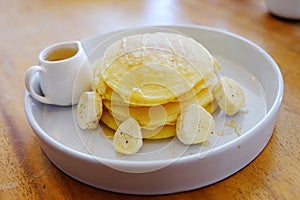 Pancake get served in the morning in the restaurant or the cafe. Food and drink set made by chef and served with hot drink.