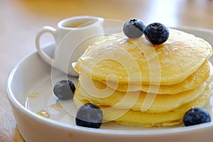 Pancake get served in the morning in the restaurant or the cafe. Food and drink set made by chef and served with hot drink.