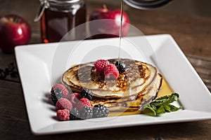 Pancake with maple sirup and berries