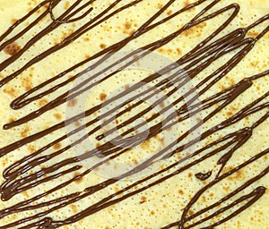 Pancake with melted chocolate texture background.