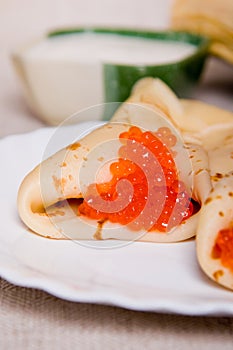 Pancake with red caviar