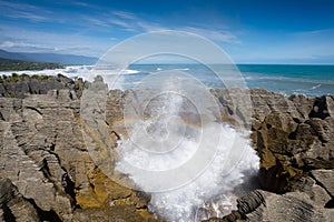 Pancake rock splash water and rainbow, Punakaiki photo