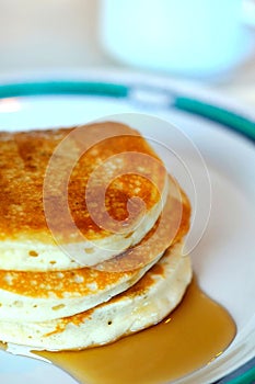 Pancake stack on white plate photo