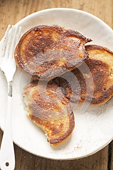 Pancakes with apples, cinnamon and icing sugar