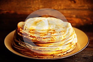Pancakes with banana, nuts and honey. Traditional Russian cuisine. Maslenitsa. Dessert.