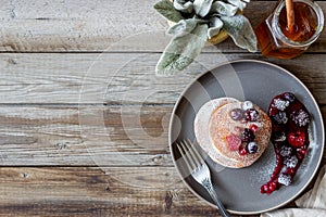 Pancakes with blackberries, raspberries and red currants. American cuisine